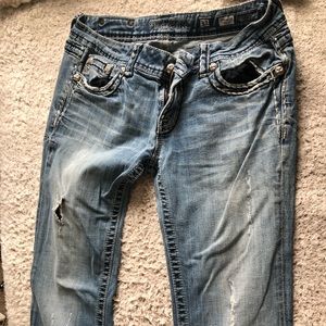 Bootcut Miss Me jeans with rips.